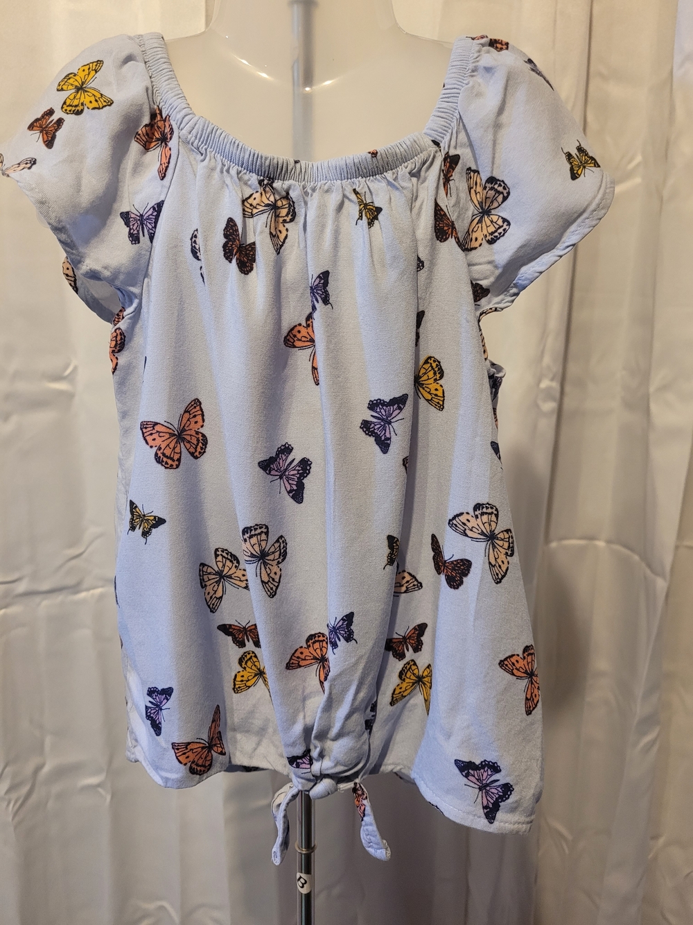 jumping beans light blue and orange clothing tag